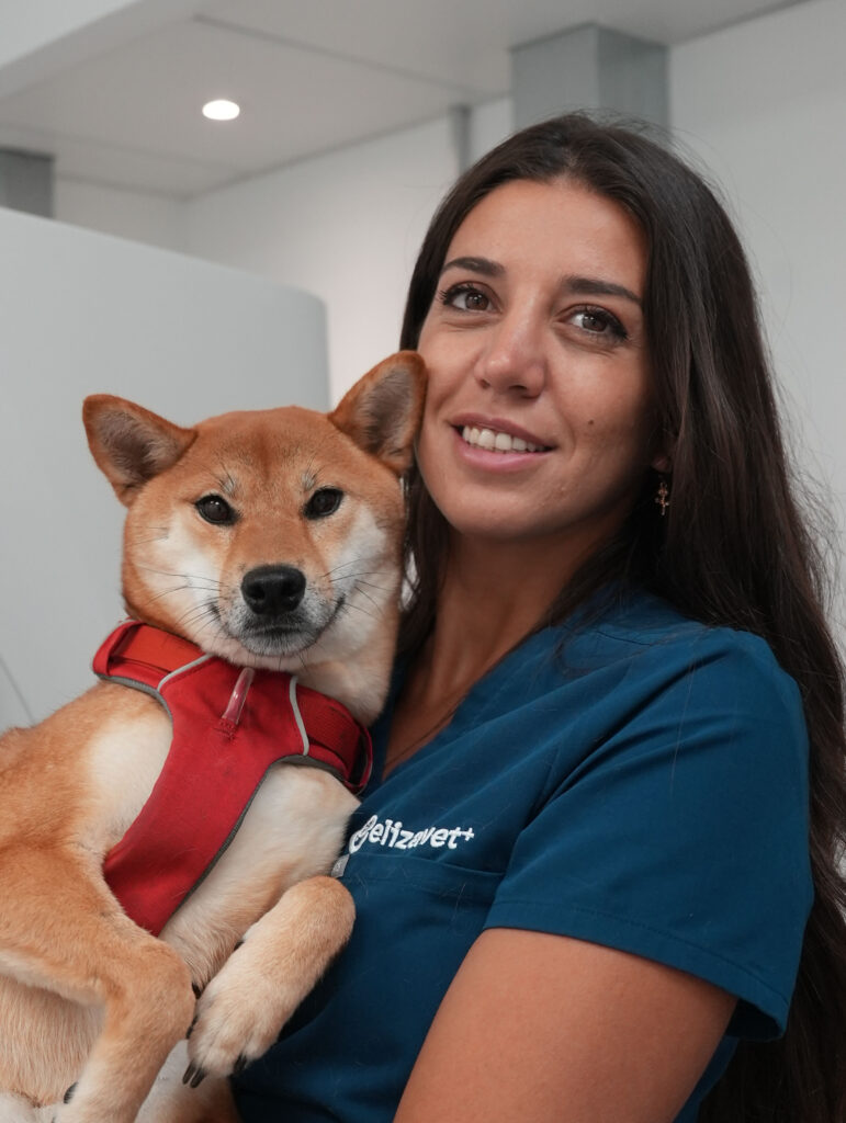 Dr Arietta Kaldi holding a dog